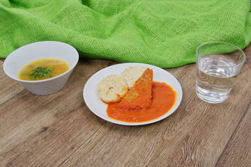 Tomto sauce with dumpling on a table