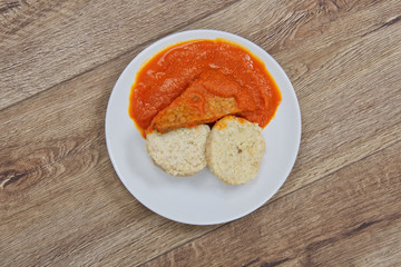 Tomto sauce with dumpling on a table