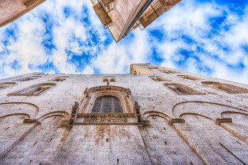 Facades of old town in Bari against blue sky