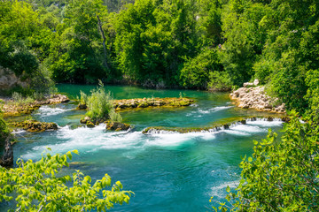 A fast mountain river flows through the rapids.