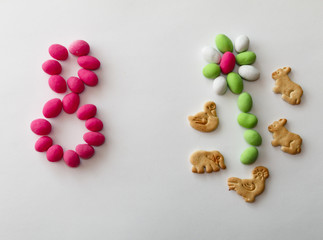 peanuts in colored glaze on white sheet