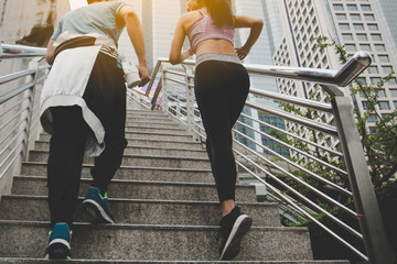 fitness, sport, people and lifestyle concept - happy couple running outdoors.