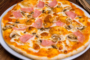 Pizza with ham and mushrooms