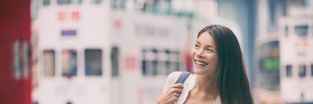 Asian Woman Walking To Work In Hong Kong City Street Banner Panorama With Copy Space On Double Decker Bus. Urban Living Young People Lifestyle. Happy Multiracial Chinese Girl Header.