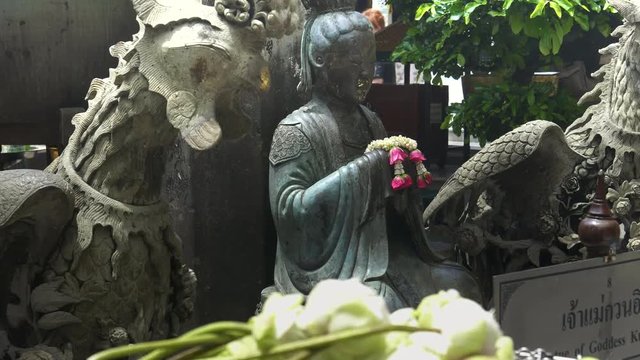 goddess kun iam statue at the temple of the emerald buddha in bangkok, thailand