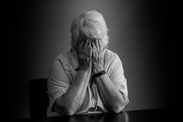 Elderly woman distressed, upset and sad