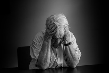 Elderly woman distressed, upset and sad