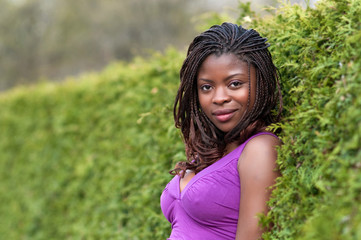 Beautiful woman next to hedge