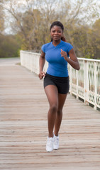 jogging woman on bridge