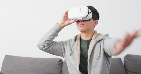 Man looking though VR device