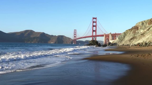 a gimbal steadicam shot walking along marshall beach with san francisco's golden gate bridge in the background