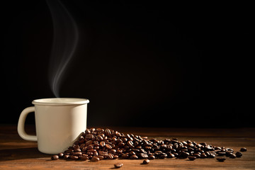 Cup of coffee with smoke and coffee beans on wooden background, This image with no smoke is available