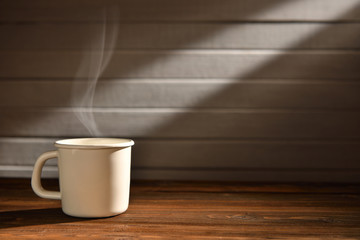 Cup of coffee with smoke on wooden background, This image with no smoke is available