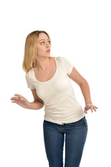 3/4 portrait of blonde girl wearing white shirt,   isolated on white background.