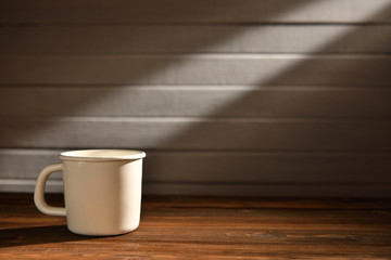 Coffee cup on old wooden background