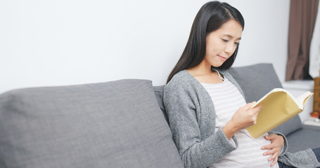 Pregnant woman reading book