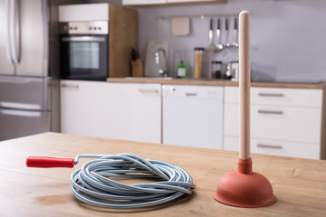 Close-up Of Plunger And Plumbing Tool