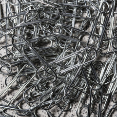 Many paper clips office on a close up detail abstract background