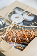 gift set for ice cream in a box: waffle cups, spoon for ice cream, sprinkles and topping