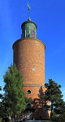 Stockholm, Vaxholm Island, Sweden - Historical sea lighthouse in town of Vaxholm on the Vaxholm island within the Stockholm region