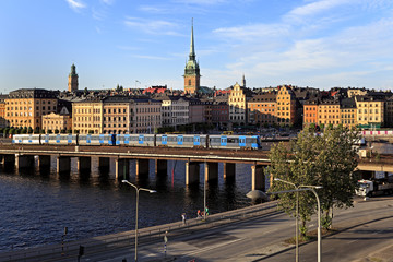 Stockholm, Sweden - Old town quarter Gamla Stan with Tyska Kyrkan - XVII century St. Gertrude church and Centralbron bridge