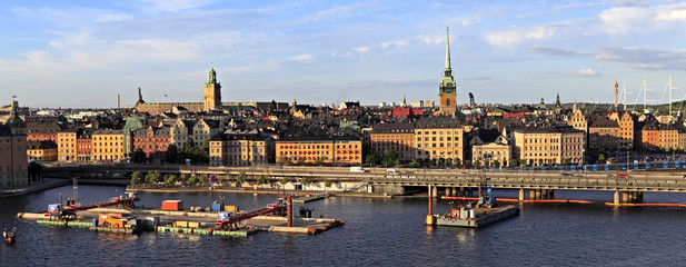 Stockholm, Sweden - Old town quarter Gamla Stan with Tyska Kyrkan - XVII century St. Gertrude church and Centralbron bridge - obrazy, fototapety, plakaty