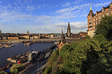 Stockholm, Sweden - Old town quarter Gamla Stan with city hall and Centralbron bridge - obrazy, fototapety, plakaty