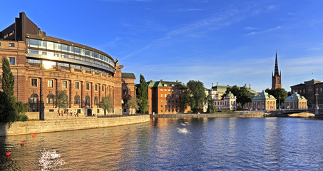 Stockholm, Sweden - Old town quarter Gamla Stan with House of Parliament and Riddarholmen church in the background - obrazy, fototapety, plakaty