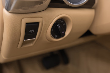 Luxury car control panel with parking button. Interior detail.