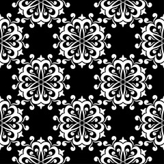 White floral design on black background. Seamless pattern