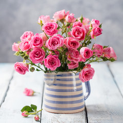 Rose flowers in vase. Beautiful romantic bouquet. Copy space