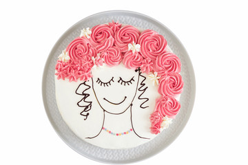 Isolated Festive vanilla cake with butter cream, an image of girl face with flower hair. View from above. White background.