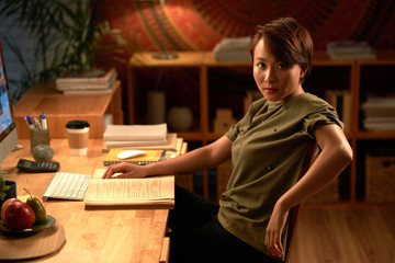 Confident student studying at home