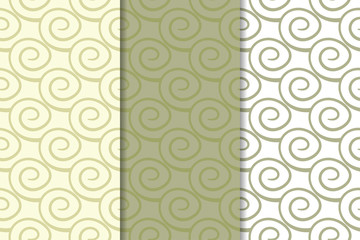 Olive green and white geometric ornaments. Set of seamless patterns