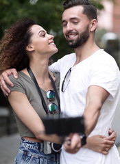 Happy traveling couple making selfie, romantic mood.