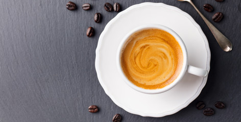 Coffee espresso in white cup. Copy space. Top view