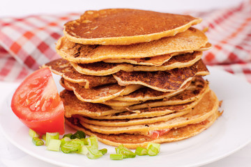 fried pancakes or pancakes are stacked - a traditional dish for the Spring Carnival festival, farewell to winter