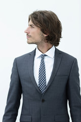 Handsome young business man looking away.