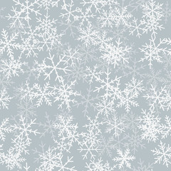 White snowflakes seamless pattern on light grey Christmas background. Chaotic scattered white snowflakes. Pleasant Christmas creative pattern. Vector illustration.