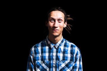 Fototapeta premium Portrait of young cool man with dreadlocks