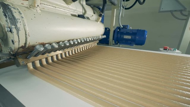 Industrial machine producing candies.