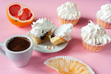  Coffee espresso in a white cup and cakes with meringues on a pink background. Gentle colors. Elegant  dessert. Serving option. Holiday. Wedding table.