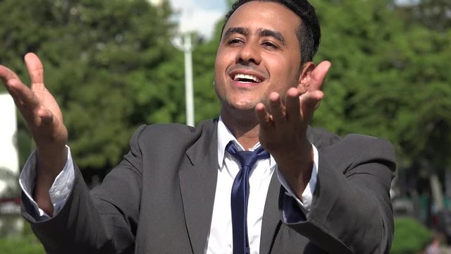 Hispanic Business Man Blowing Kisses