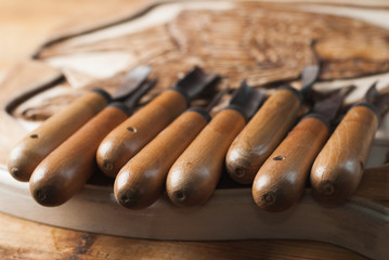 Handicraft background, tools for wood carving,