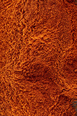Texture background. Red chilli pepper powder. Top view
