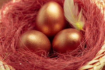 gold eggs on wooden table