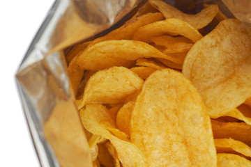 Potato chips in a silver package isolated on a white background close-up.