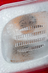 Plastic rear light with frost on the surface.