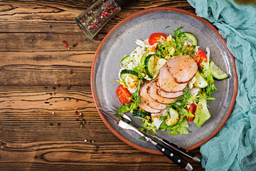 Veal salad with fresh vegetables. Dietary food. Meat salad. Top view. Flat lay.