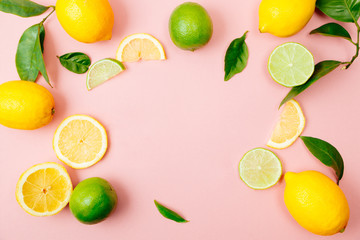 Lime and lemon frame on pink background